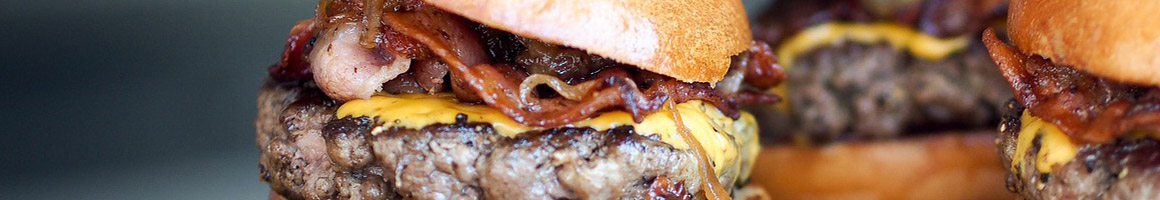 Eating Barbeque Burger Southern at Red Hot and Blue Fairfax restaurant in Fairfax, VA.